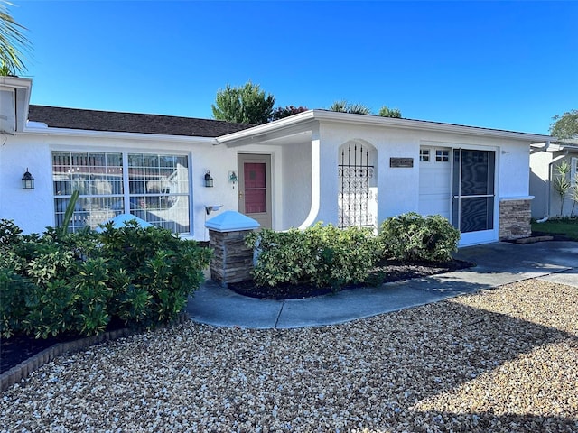 view of front of house featuring stucco siding