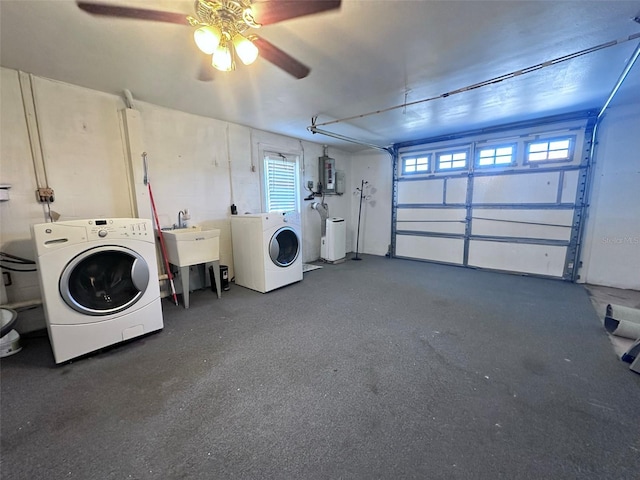 laundry area featuring a sink, a garage, separate washer and dryer, and ceiling fan