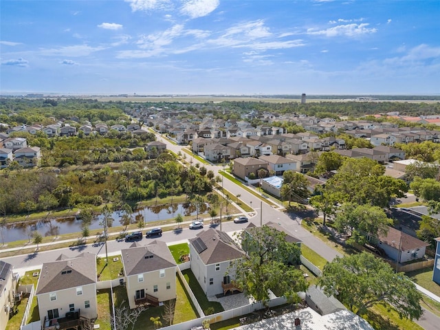 bird's eye view with a water view and a residential view