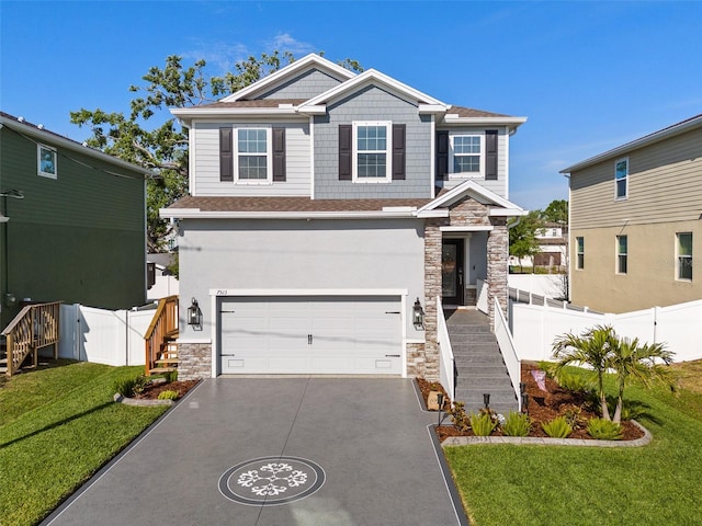 view of front of house featuring fence, a front lawn, concrete driveway, an attached garage, and stone siding