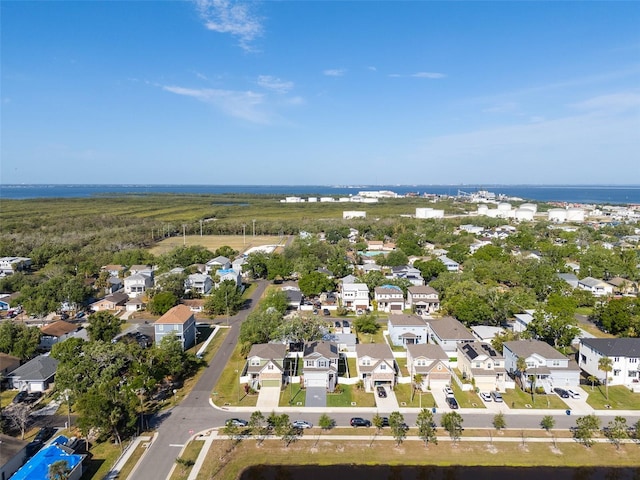 drone / aerial view with a water view and a residential view