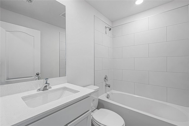 bathroom featuring toilet, vanity, shower / bath combination, and visible vents