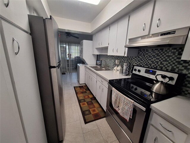 605 Brandy Wine Dr Unit 605, Largo, FL 33771 - kitchen with backsplash, under cabinet range hood, a sink, and stainless steel appliances