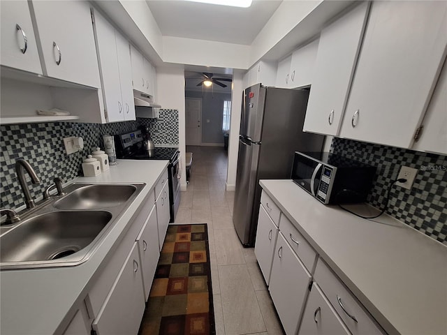 605 Brandy Wine Dr Unit 605, Largo, FL 33771 - kitchen featuring ceiling fan, tasteful backsplash, a sink, exhaust hood, and black electric range