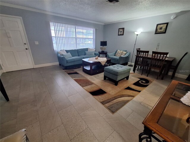 605 Brandy Wine Dr Unit 605, Largo, FL 33771 - living room featuring a textured ceiling, visible vents, ornamental molding, and baseboards