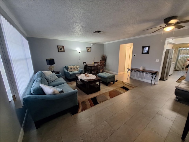605 Brandy Wine Dr Unit 605, Largo, FL 33771 - living area featuring a ceiling fan, ornamental molding, a textured ceiling, and visible vents