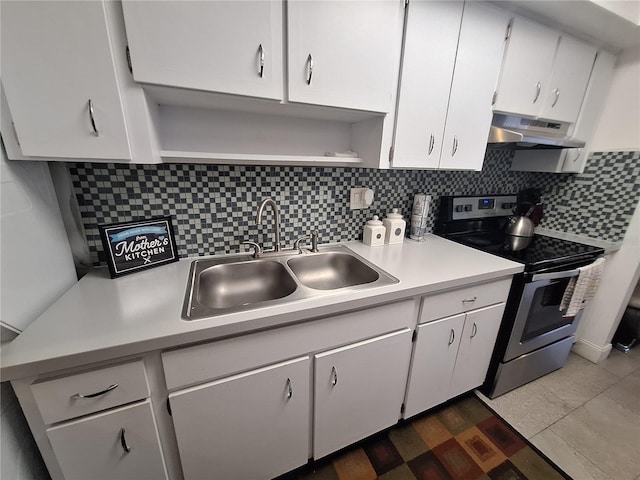 605 Brandy Wine Dr Unit 605, Largo, FL 33771 - kitchen with light countertops, open shelves, stainless steel range with electric stovetop, under cabinet range hood, and a sink