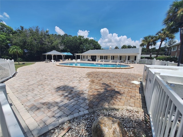 605 Brandy Wine Dr Unit 605, Largo, FL 33771 - pool with central air condition unit, fence, and a patio area