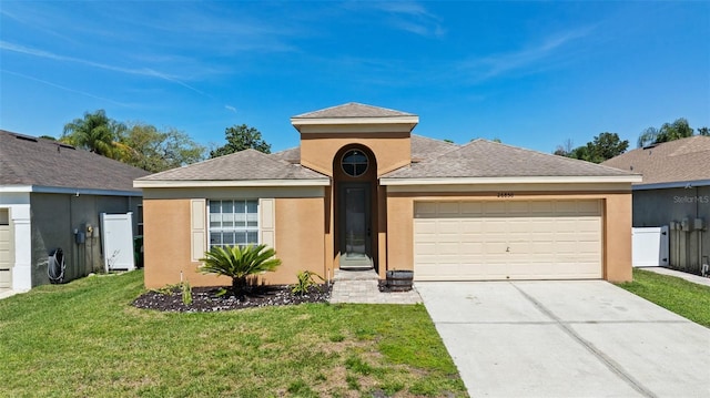 26850 Middleground Loop, Wesley Chapel, FL 33544 - view of front facade with a garage, stucco siding, concrete driveway, and roof with shingles