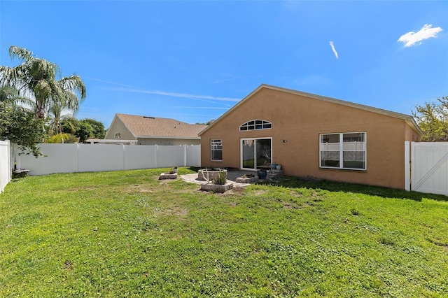 26850 Middleground Loop, Wesley Chapel, FL 33544 - rear view of property featuring stucco siding and a gate