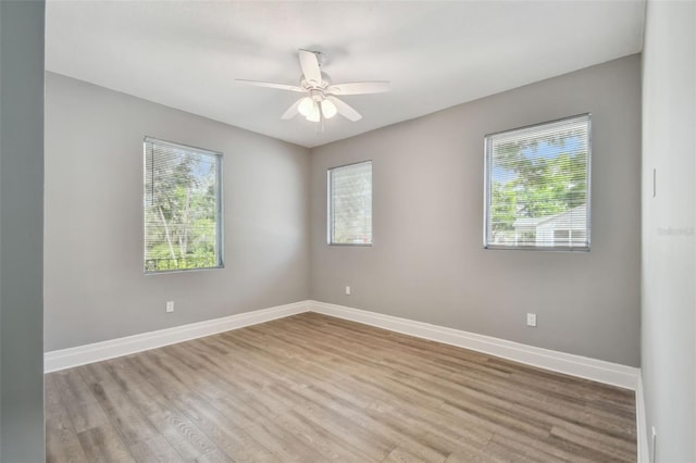 3411 N 12th St, Tampa, FL 33605 - empty room with a ceiling fan, baseboards, and wood finished floors