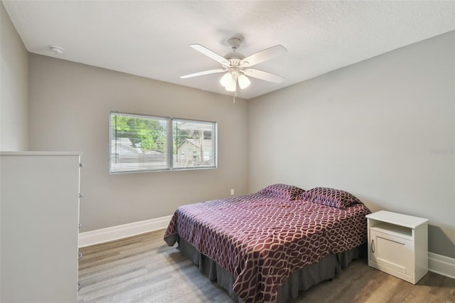 3411 N 12th St, Tampa, FL 33605 - bedroom featuring a ceiling fan, baseboards, and wood finished floors