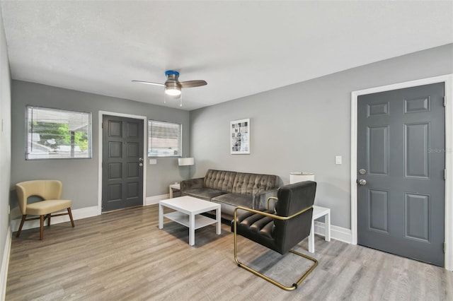 3411 N 12th St, Tampa, FL 33605 - living room featuring a healthy amount of sunlight, ceiling fan, and wood finished floors