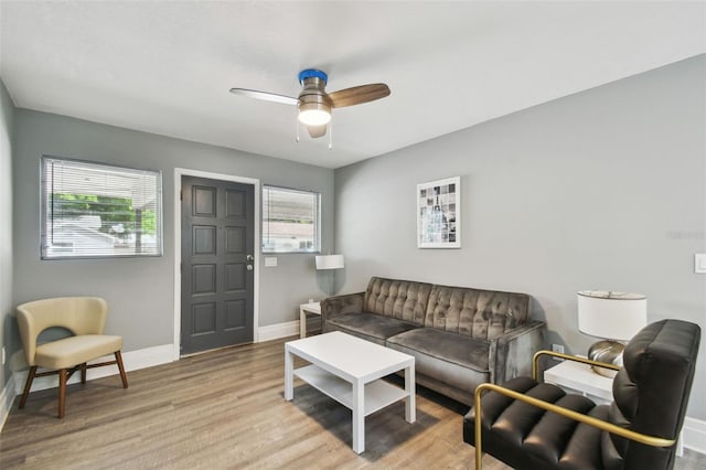 3411 N 12th St, Tampa, FL 33605 - living area featuring a ceiling fan, baseboards, and wood finished floors