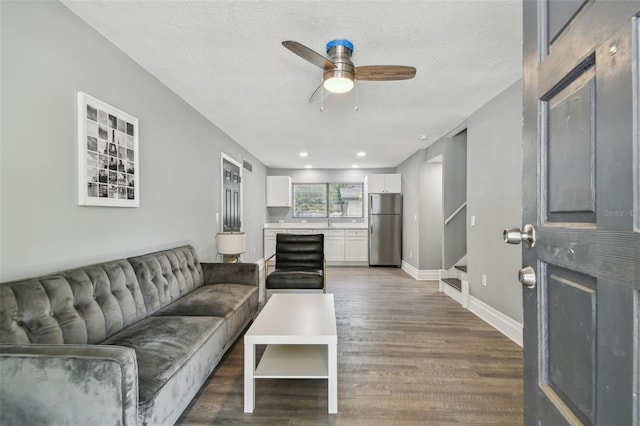 3411 N 12th St, Tampa, FL 33605 - living room with stairs, baseboards, a textured ceiling, a ceiling fan, and wood finished floors