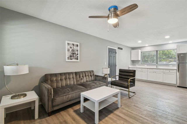 3411 N 12th St, Tampa, FL 33605 - living room featuring light wood finished floors, visible vents, ceiling fan, and recessed lighting