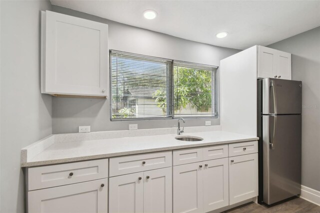 3411 N 12th St, Tampa, FL 33605 - kitchen featuring white cabinetry, a sink, recessed lighting, and freestanding refrigerator