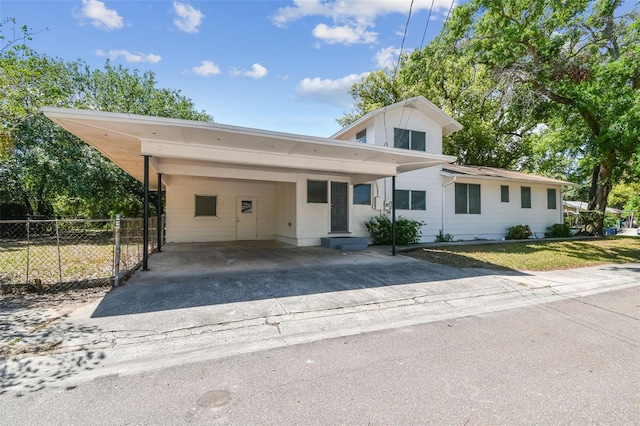 3411 N 12th St, Tampa, FL 33605 - view of front of property with an attached carport, driveway, fence, and a front lawn