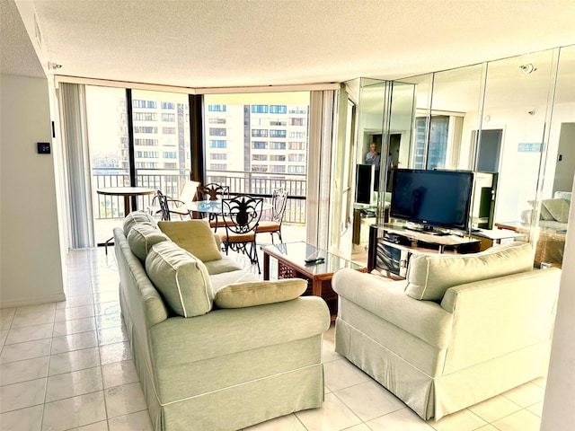 690 Island Way Unit 707, Clearwater Beach, FL 33767 - living area featuring floor to ceiling windows, tile patterned floors, and a textured ceiling
