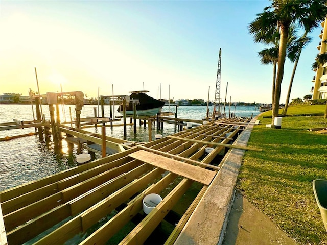 690 Island Way Unit 707, Clearwater Beach, FL 33767 - dock area featuring boat lift, a water view, and a yard