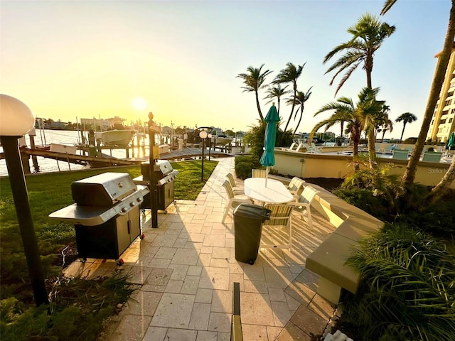 690 Island Way Unit 707, Clearwater Beach, FL 33767 - view of patio featuring a grill, boat lift, and a boat dock