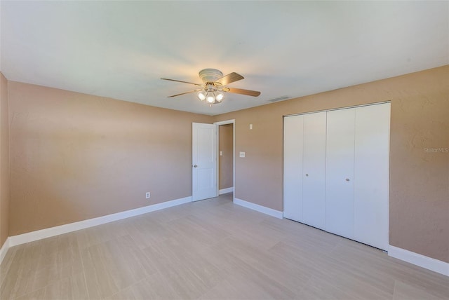 unfurnished bedroom featuring a closet, visible vents, and baseboards