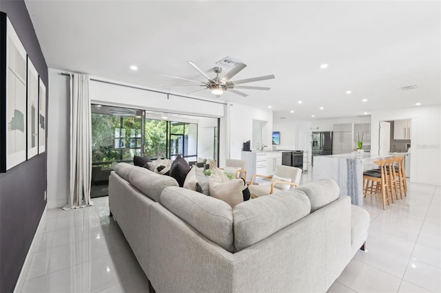 living room with recessed lighting, light tile patterned floors, visible vents, and a ceiling fan