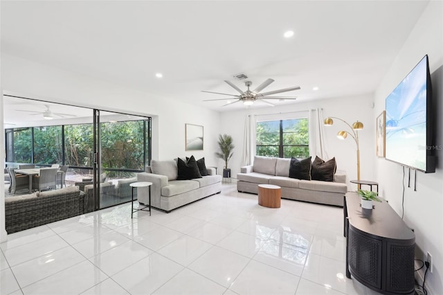 living room with recessed lighting, visible vents, light tile patterned flooring, and ceiling fan