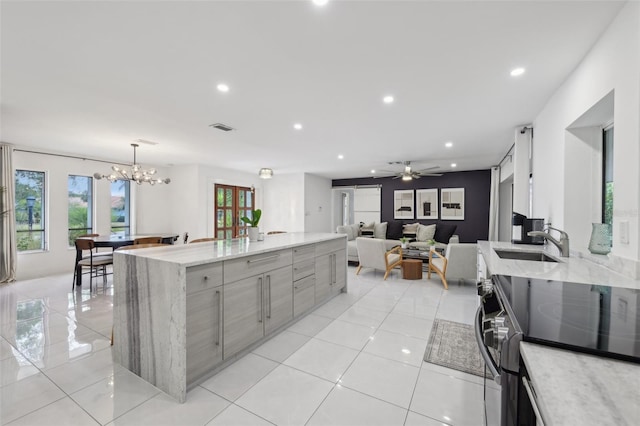 kitchen with gray cabinets, electric range, visible vents, modern cabinets, and a sink