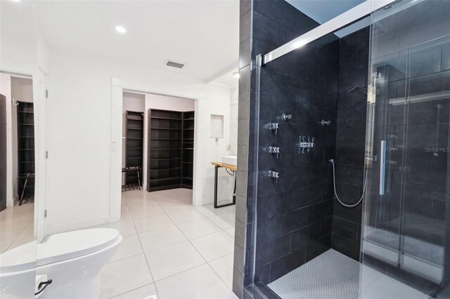 bathroom with a stall shower, tile patterned flooring, and visible vents