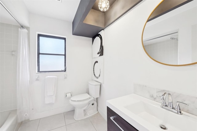 bathroom with toilet, tile patterned floors, vanity, and shower / bath combo with shower curtain