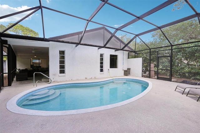 pool featuring a patio, a lanai, and an outdoor hangout area