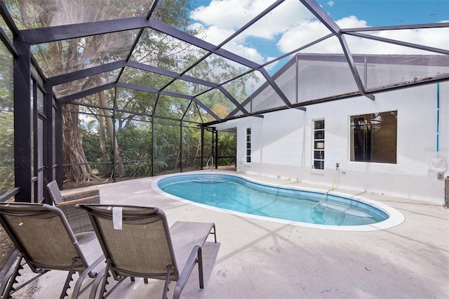 outdoor pool featuring a lanai and a patio