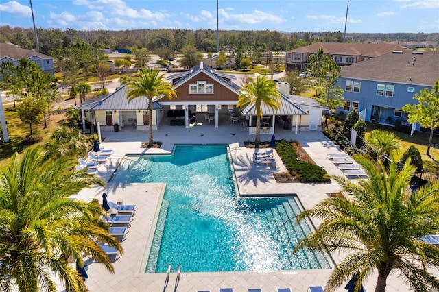 pool with a gazebo and a patio area