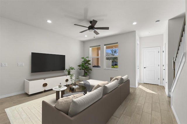 living room with baseboards, wood finished floors, recessed lighting, and a ceiling fan