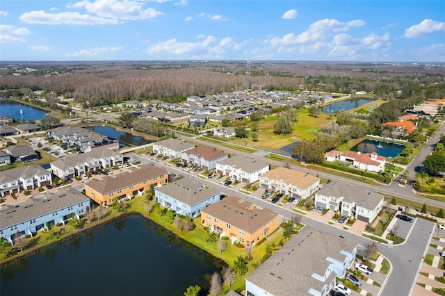 birds eye view of property with a residential view and a water view