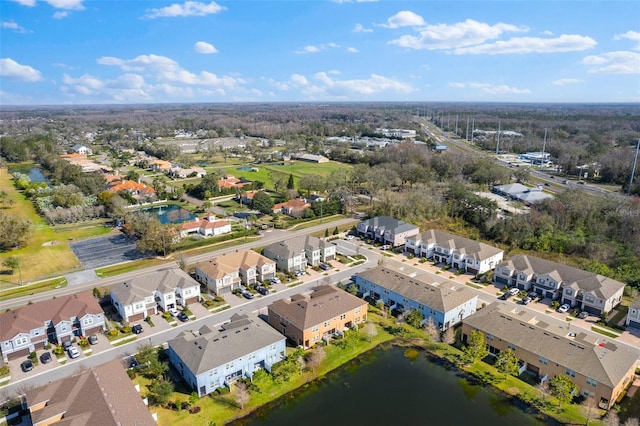 bird's eye view featuring a residential view and a water view