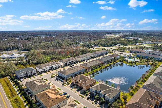 drone / aerial view with a residential view and a water view
