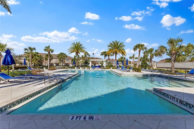 community pool with a patio area