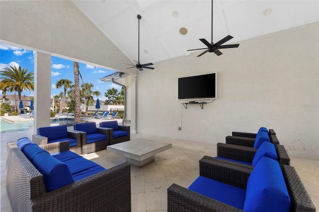 view of patio / terrace featuring a ceiling fan, a community pool, and outdoor lounge area