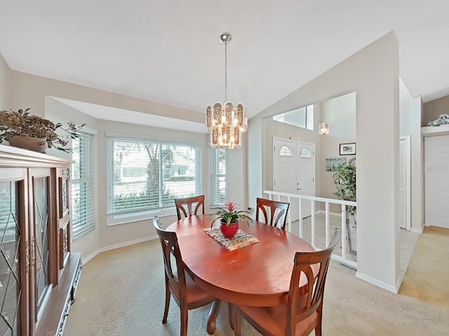 dining area featuring light carpet, baseboards, lofted ceiling, and a notable chandelier
