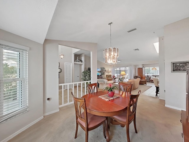 dining room featuring baseboards, a notable chandelier, and visible vents