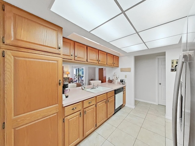 kitchen with light tile patterned flooring, light countertops, dishwasher, a sink, and stainless steel refrigerator with ice dispenser