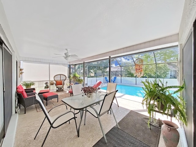 sunroom featuring a ceiling fan