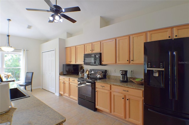 kitchen featuring decorative light fixtures, vaulted ceiling, light brown cabinetry, a ceiling fan, and black appliances