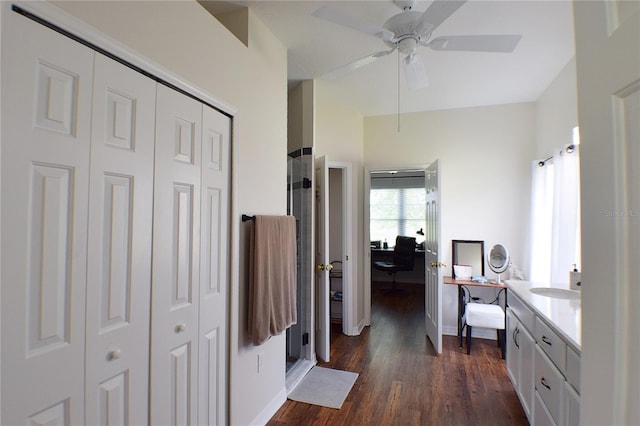 full bath with a closet, vanity, wood finished floors, and a ceiling fan