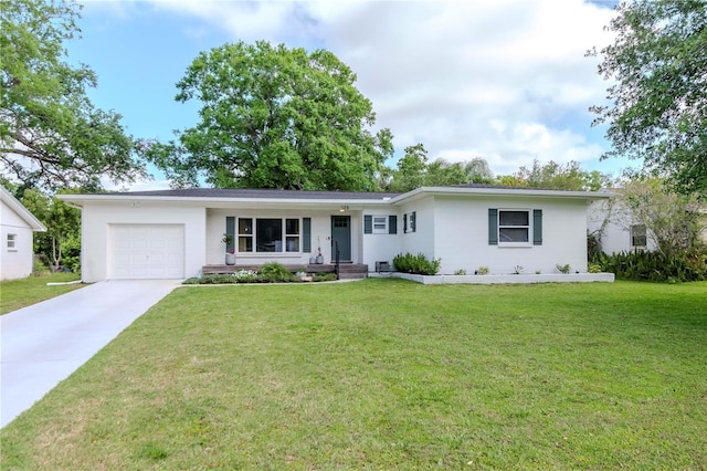 125 Siobhan Ave, Tampa, FL 33613 - ranch-style house with driveway, a front lawn, and an attached garage