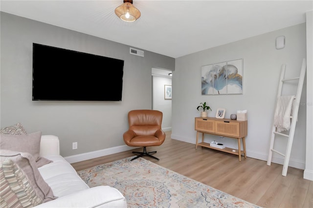 125 Siobhan Ave, Tampa, FL 33613 - living room with baseboards, visible vents, and light wood finished floors