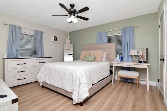 125 Siobhan Ave, Tampa, FL 33613 - bedroom with baseboards, light wood finished floors, and ceiling fan