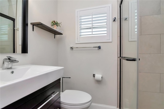 125 Siobhan Ave, Tampa, FL 33613 - bathroom with baseboards, toilet, and a stall shower